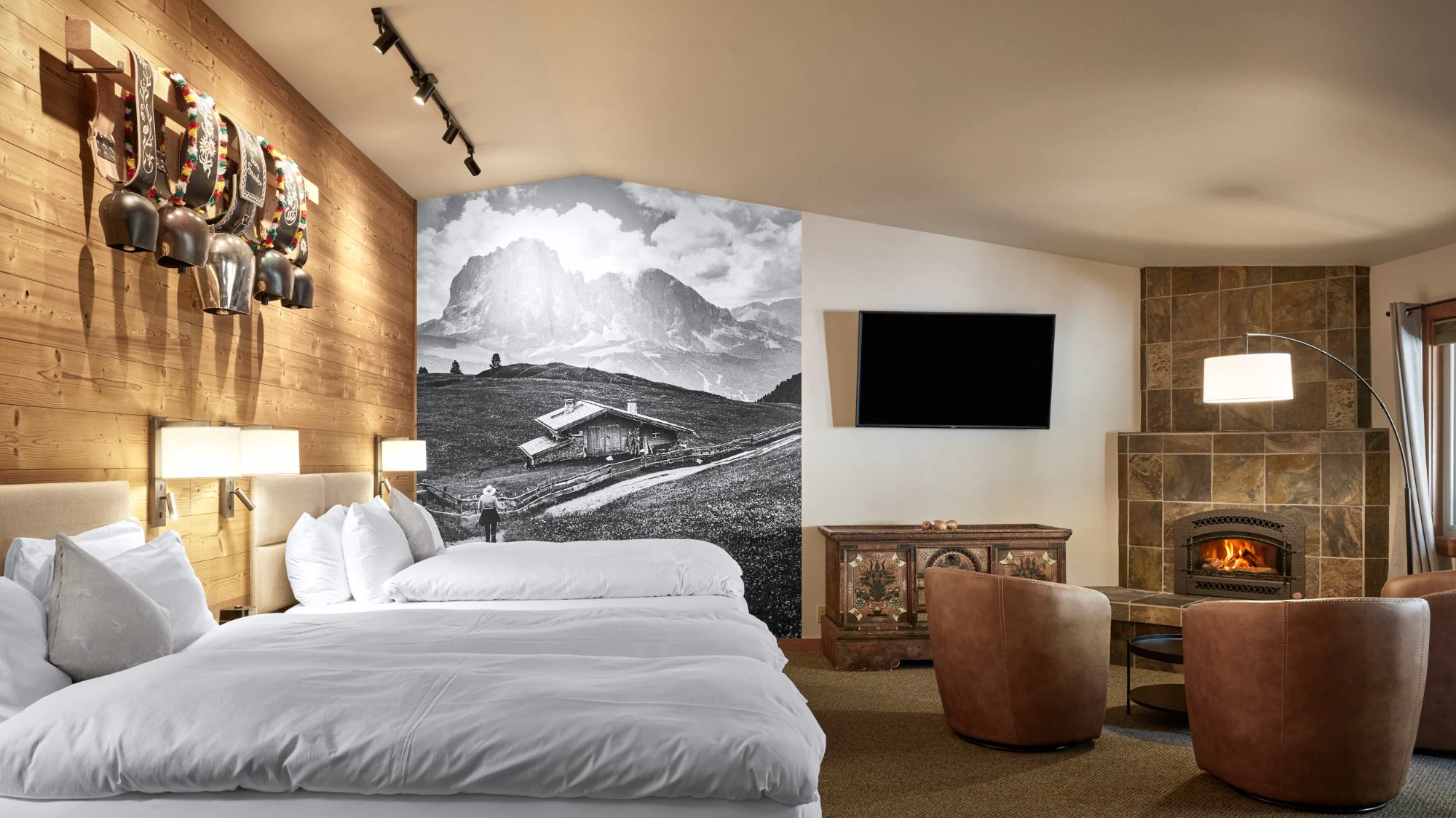 Autumn Suite two queen beds, cowbell rack, mural, and fireplace